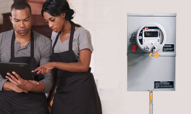 Two business owners looking at power use from their smart meter