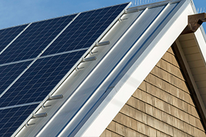 The roof of a home with solar panels. 
